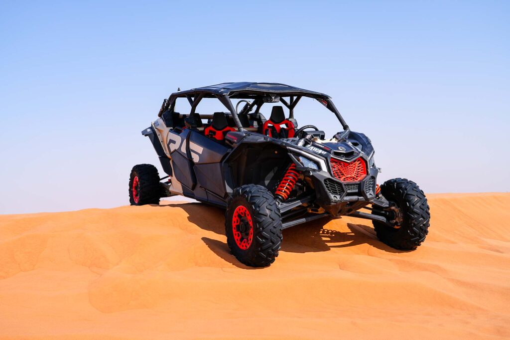 Group dune buggy experience in Dubai desert terrain