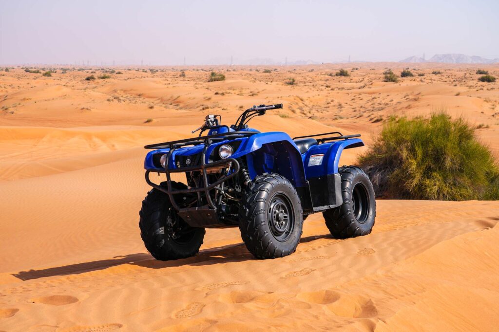 Guided quad safari route through Lahbab red dunes
