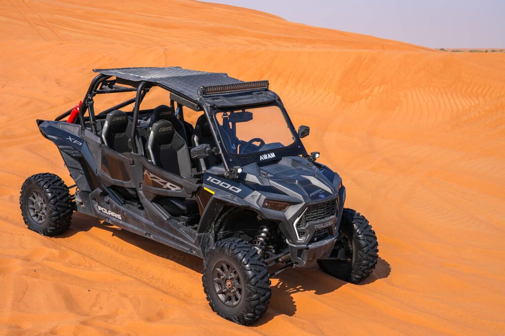Sunset buggy ride across Dubai red dunes