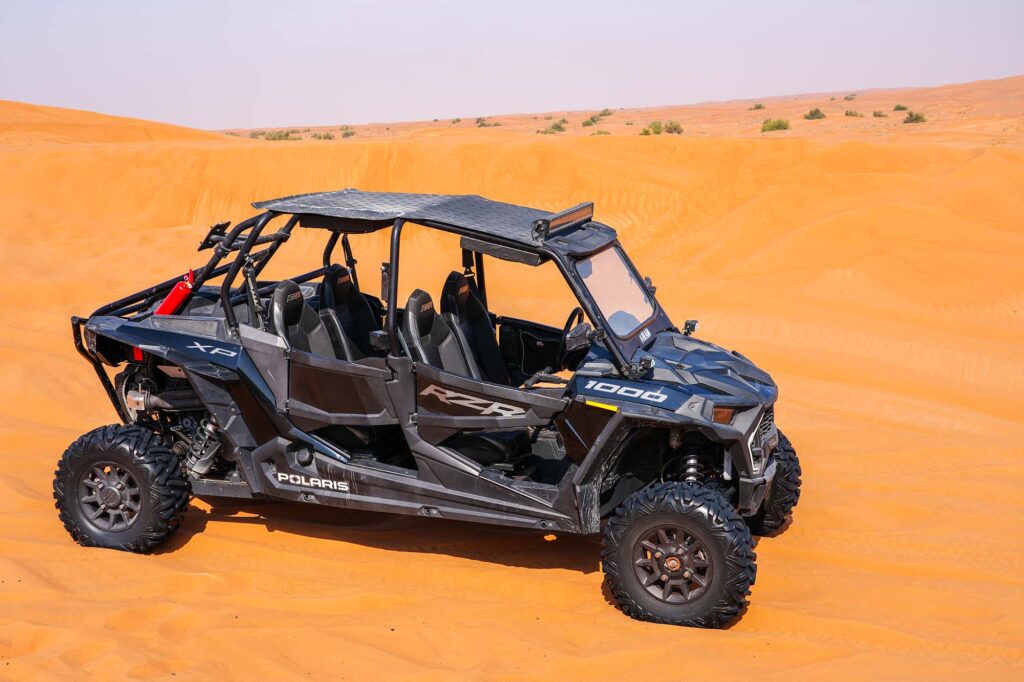 Buggy tour at sunset in Dubai desert dunes