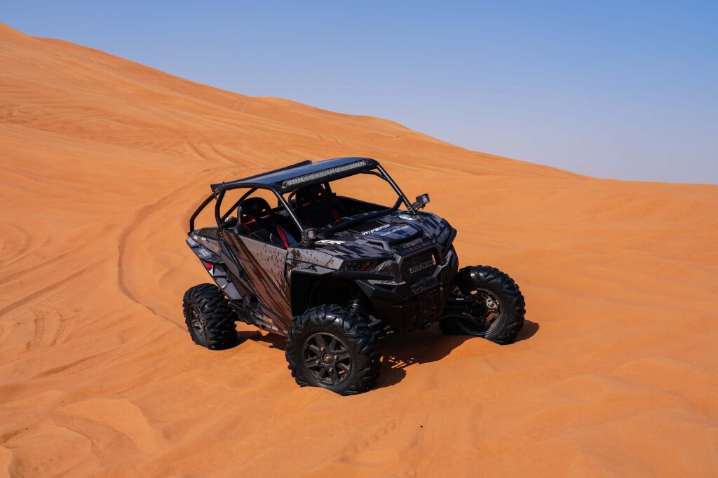 Polaris dune buggy in Dubai red sand